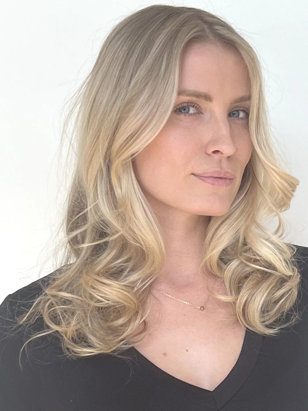 Blonde blowout with soft curled ends